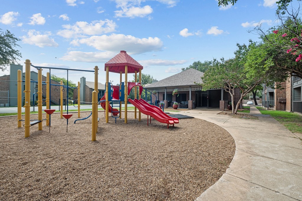 a playground at legacy apartments in plano, tx