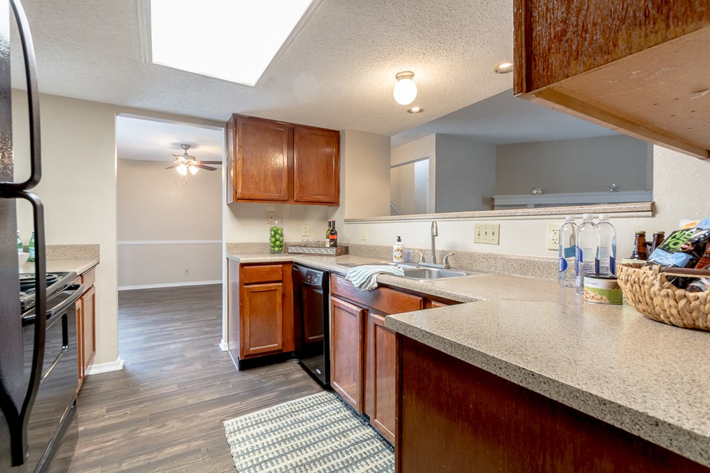 Kitchen with wooden cabinets at Amberly Village Townhomes, Texas, 75040