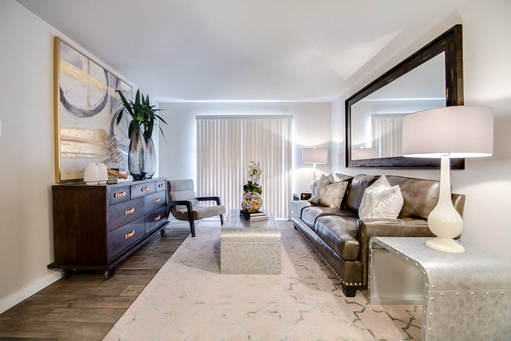 a living room with a couch and a dresser