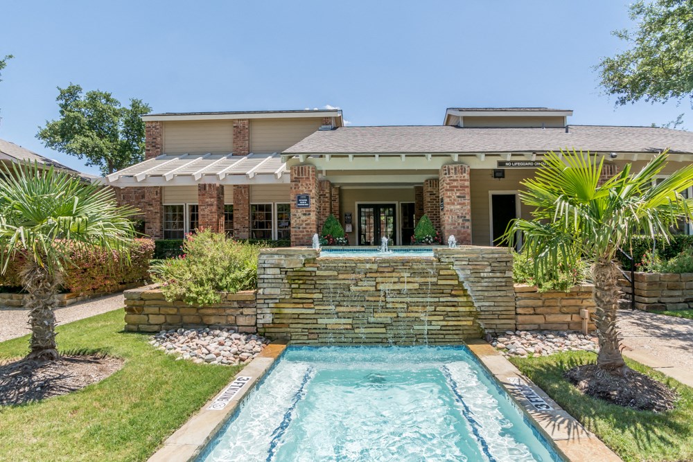 a house with a swimming pool in front of it