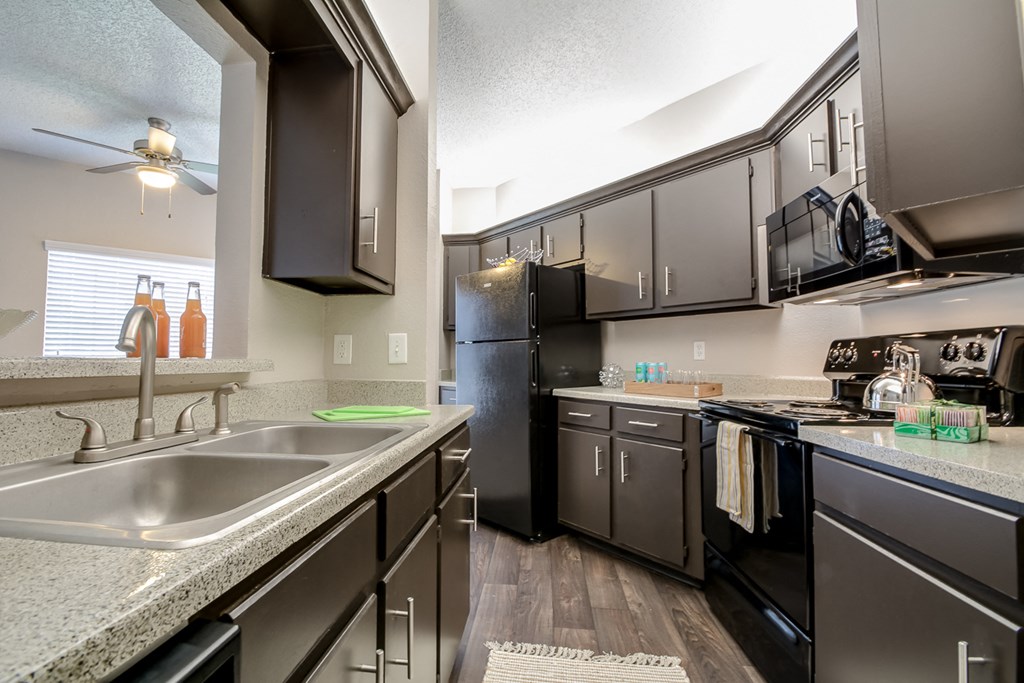 redesigned kitchen with granite counter tops and stainless steel appliances at the preserve at greatstone