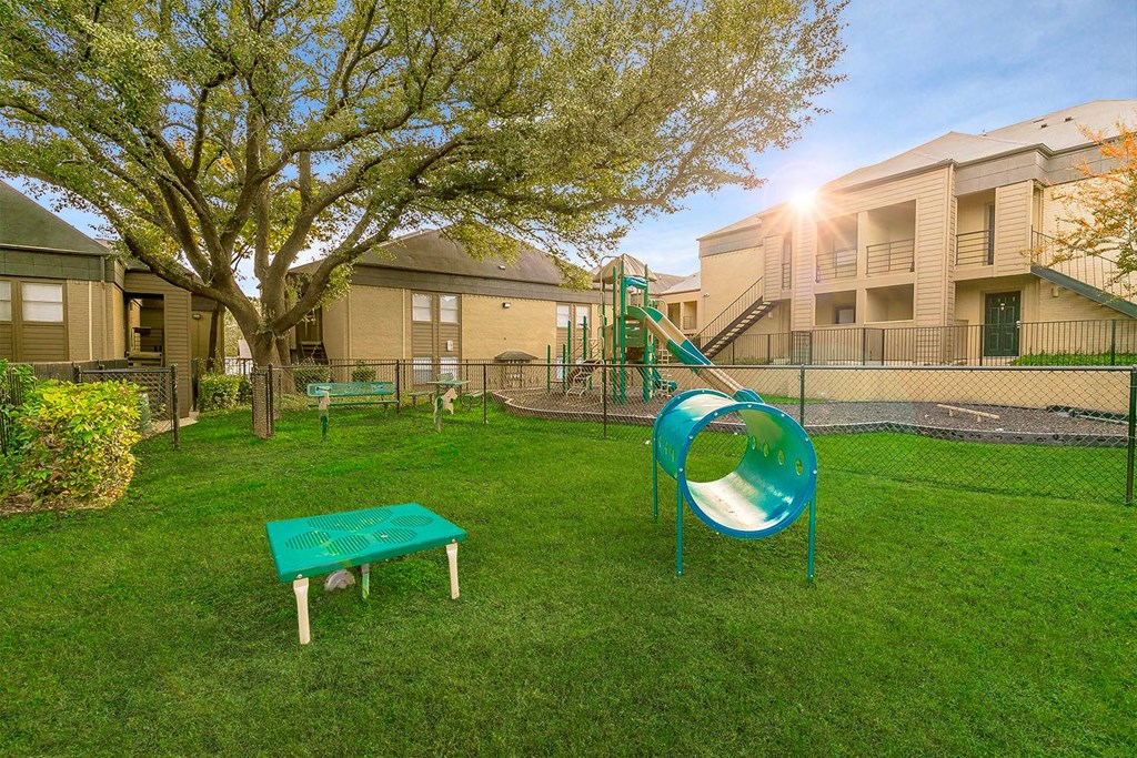 our apartments showcase a dog park with a playground