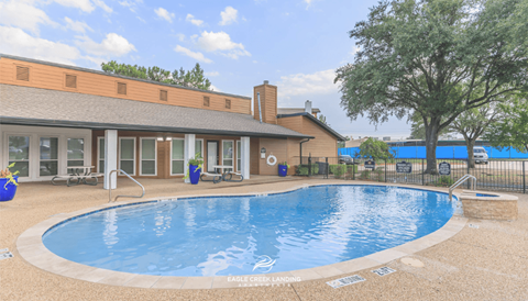 A pool with the words Eagle Creek Landing on the side.