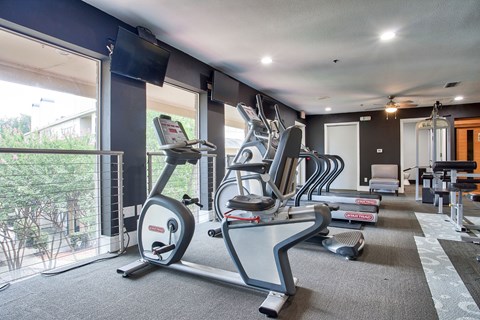 Fitness center with cardio and strength equipment at Country Club Apartments, Mesquite, 75150
