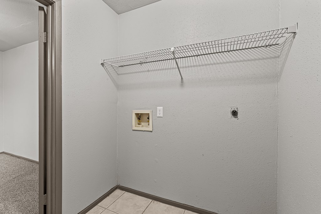 Empty room with a wire shelf and a door.at Rock 35, Round Rock