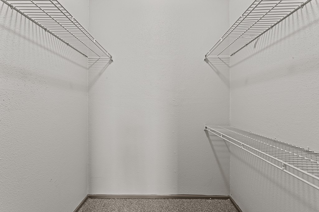 Empty shelves in a white room.at Rock 35, Round Rock, TX