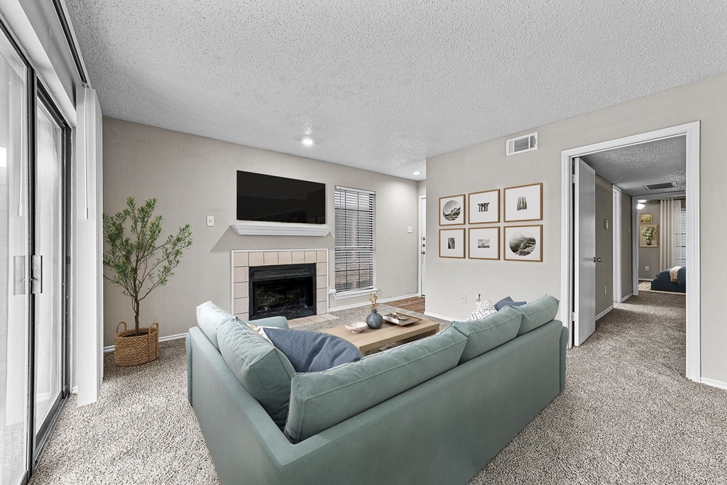 a living room with a couch and a fireplace