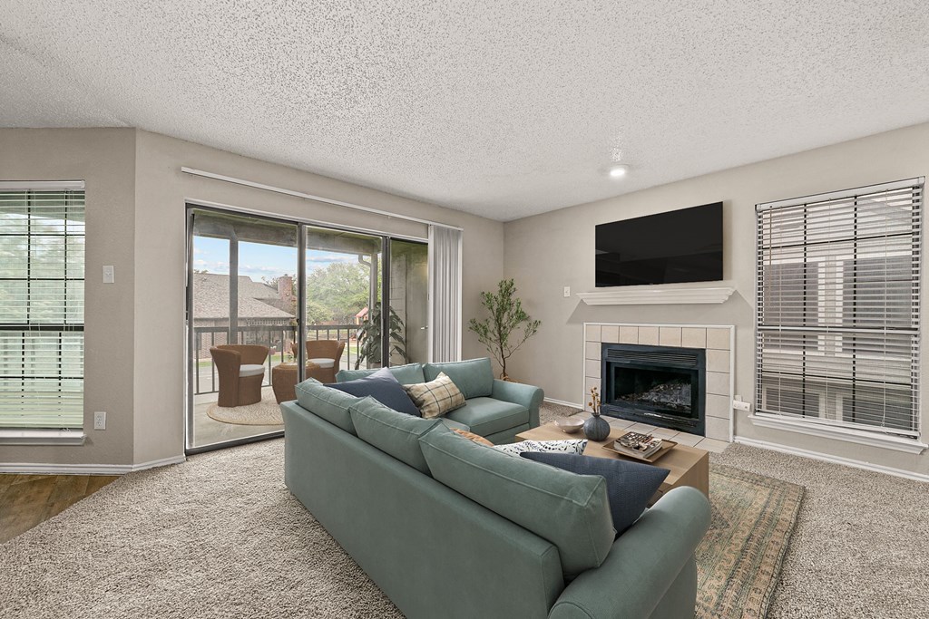 a living room with a couch and a fireplace