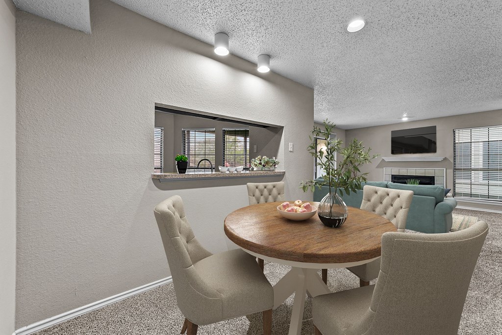 a dining room with a table and chairs