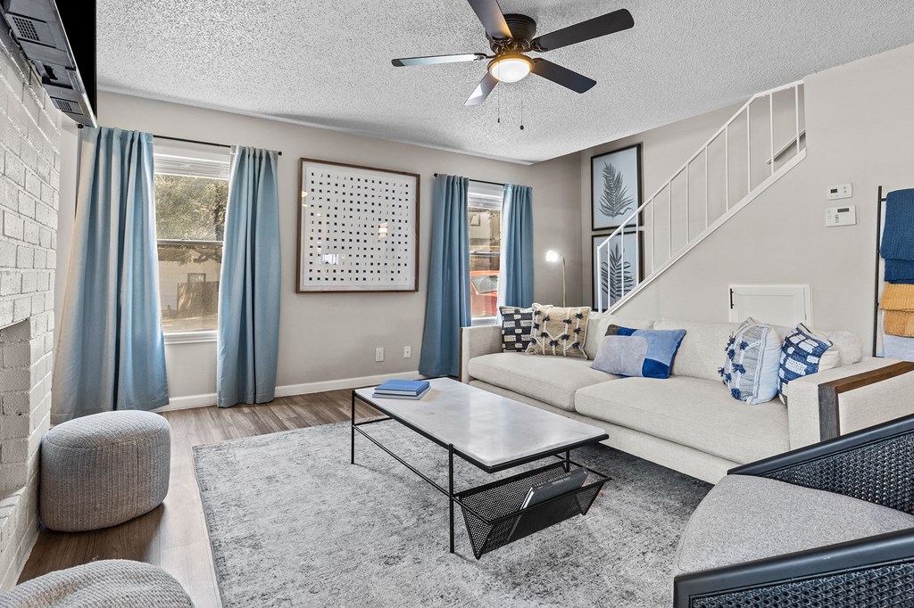 Living room area with couch and center table at Maxwell Townhomes, Texas
