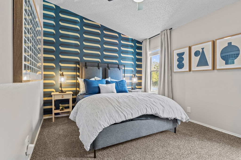Bedroom with cozy bed at Maxwell Townhomes, San Antonio