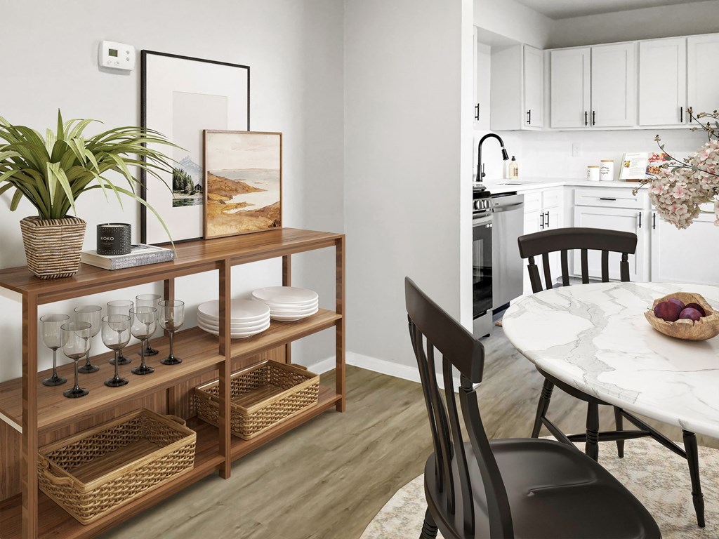 a dining room with a table and chairs and a kitchen in the background  at Sunset Heights, San Antonio