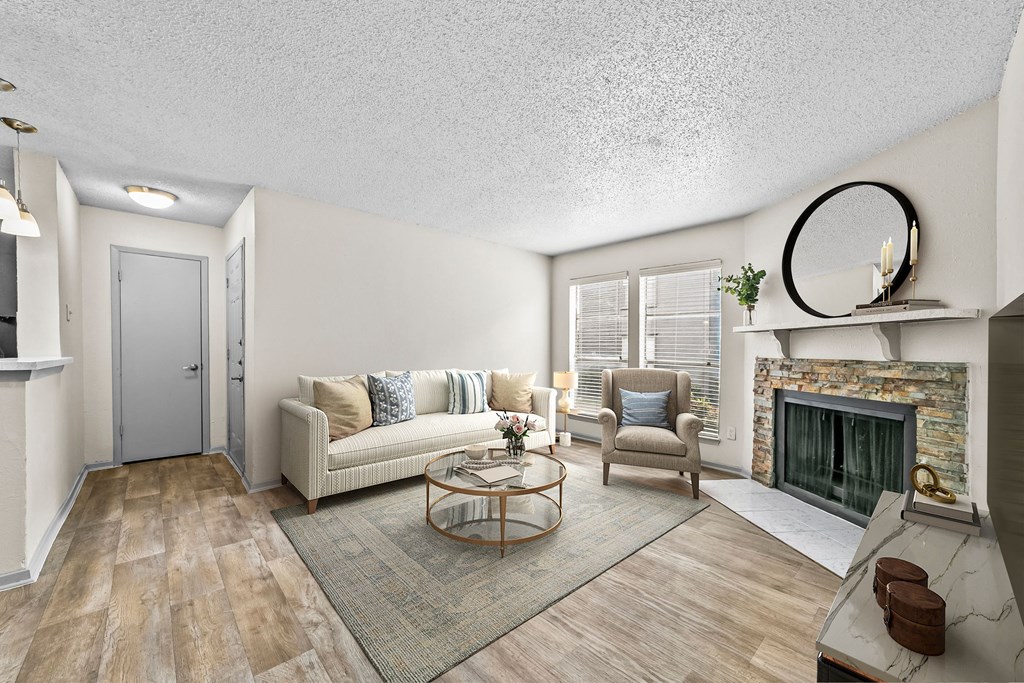 a living room with a fireplace and a couch  at Vesper, Dallas, TX, 75254