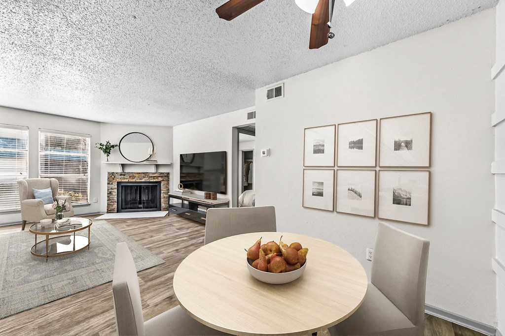 a dining room table with a bowl of fruit on top of it  at Vesper, Dallas, 75254