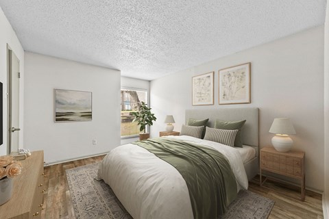 a bedroom with white walls and a green bedspread  at Vesper, Dallas, TX