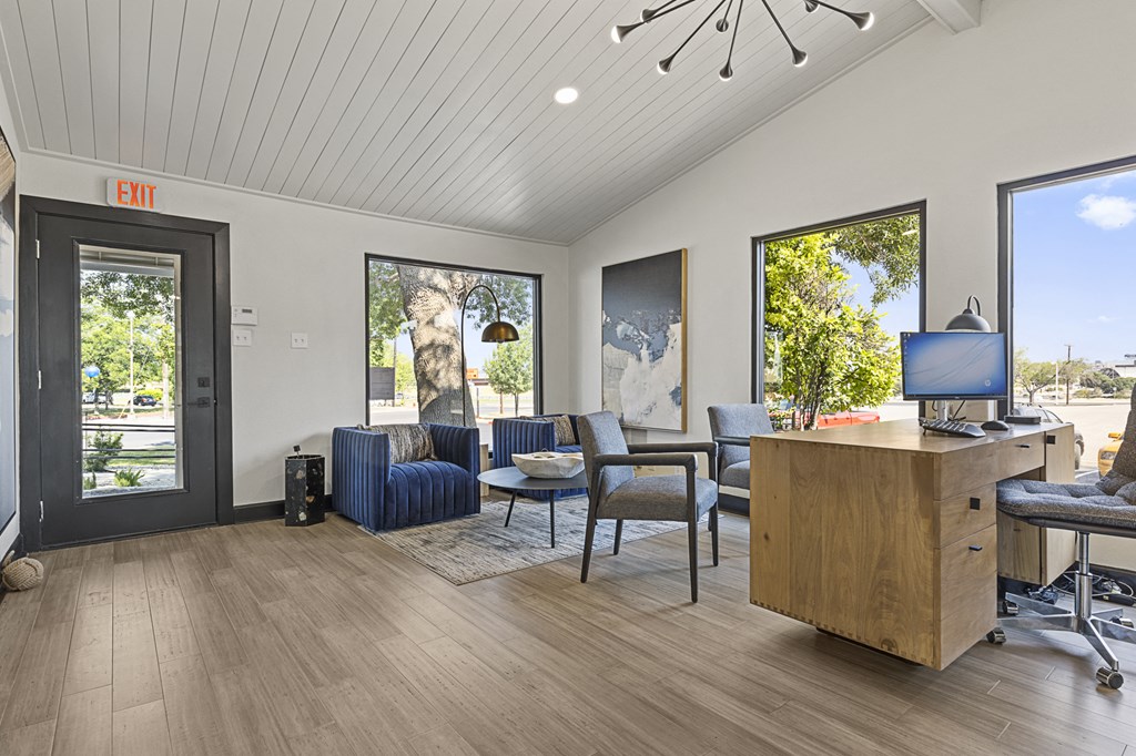 the preserve at ballantyne commons community room with a desk and a tv