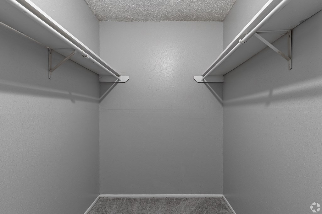 a spacious walk in closet at the acadia park apartments in houma, la at The Frederick, San Antonio, TX
