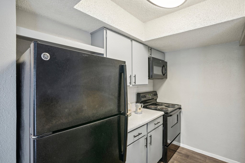 The Keller apartment kitchen with refrigerator, stove, oven and microwave