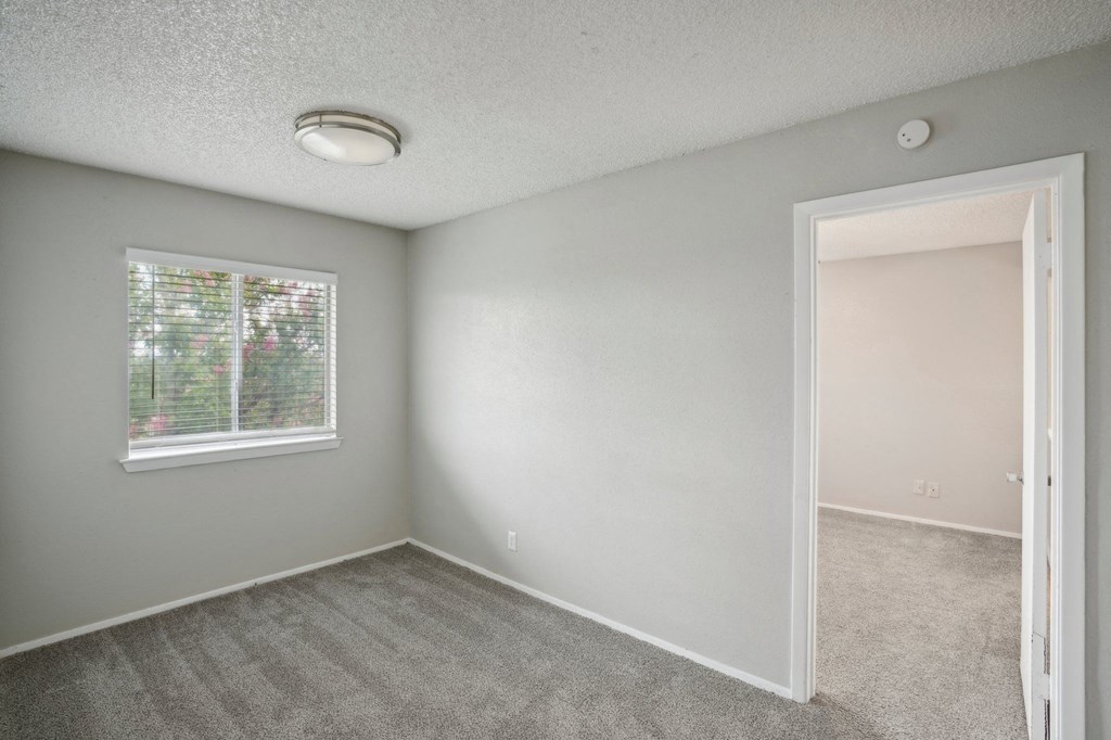 a bedroom with a window