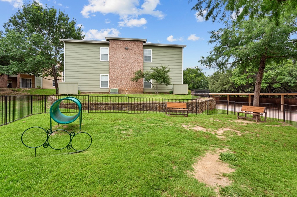 apartments have a fenced in yard with a playground at Southgate Glen, Weatherford, TX, 76086