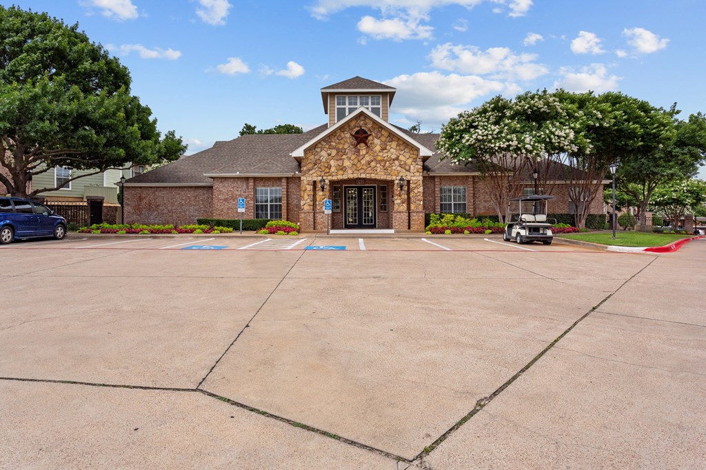 an empty parking lot in front of a brick building at Southgate Glen, Weatherford, TX