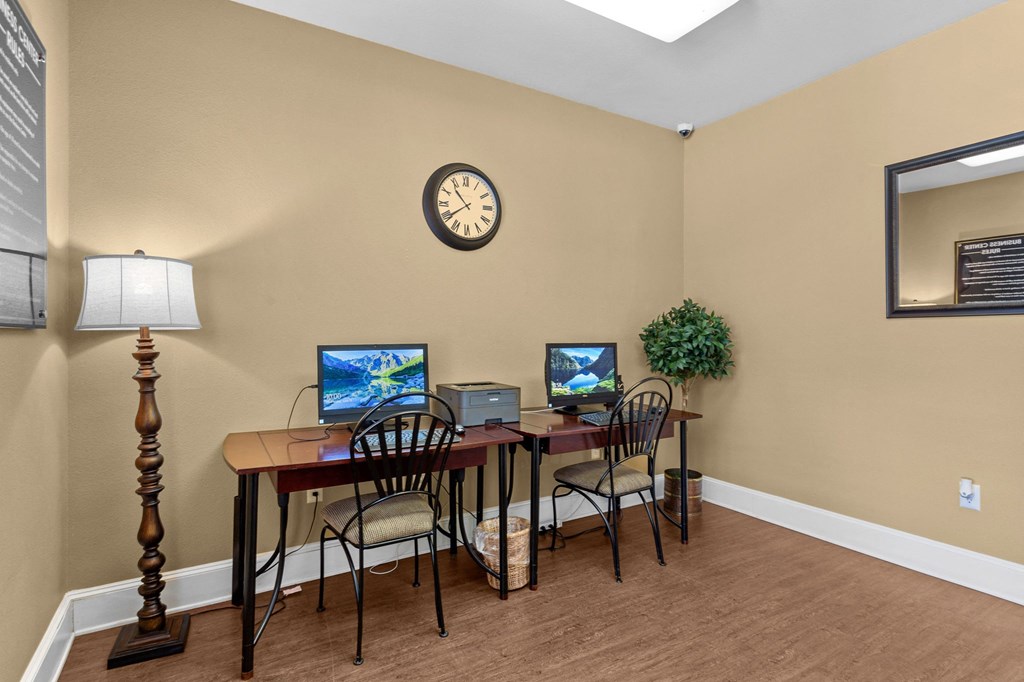 an office with a desk with two computers and a clock on the wall at Southgate Glen, Weatherford, Texas