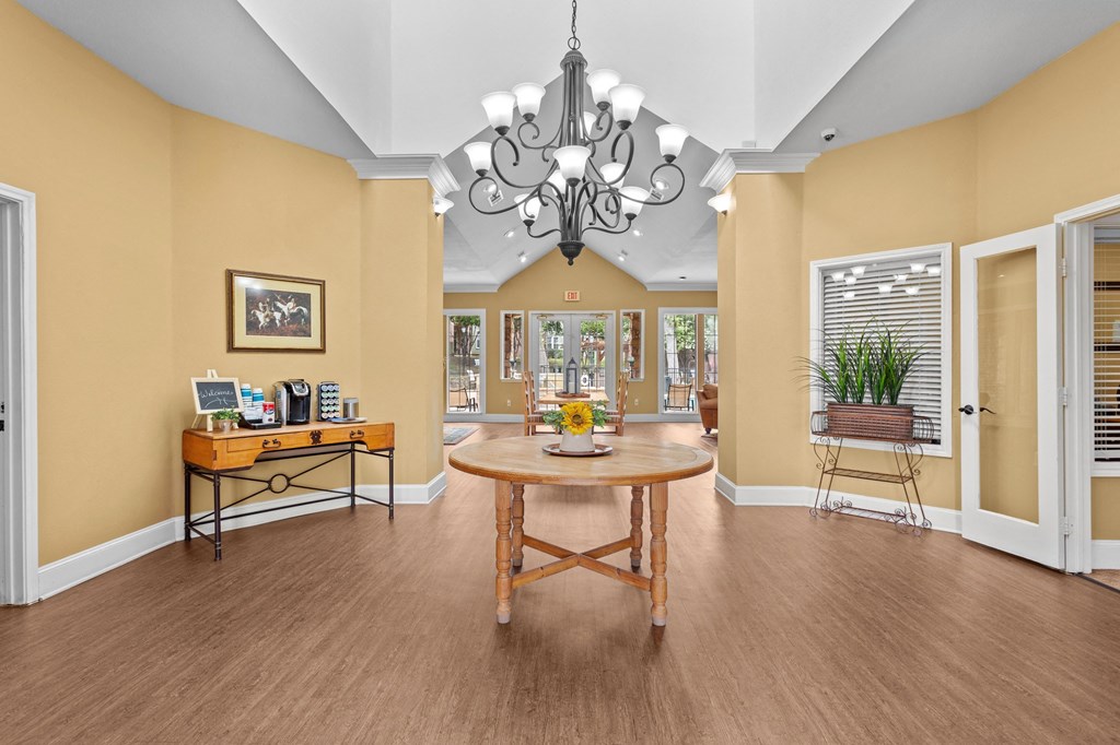 a dining room with a table and a chandelier at Southgate Glen, Texas