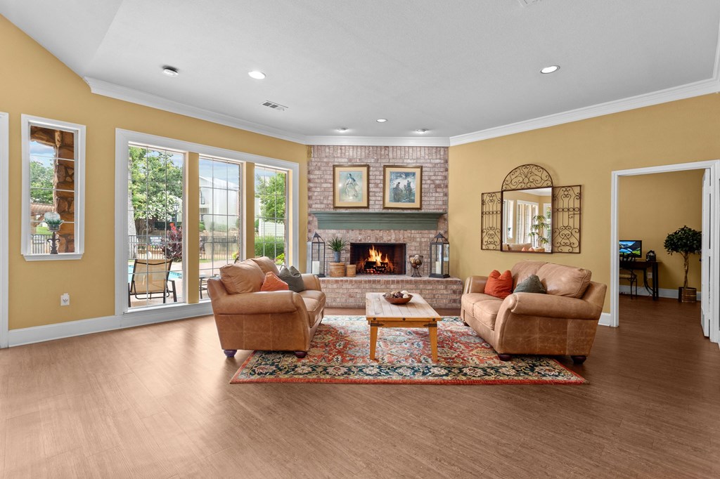 a living room with two couches and a fireplace at Southgate Glen, Weatherford