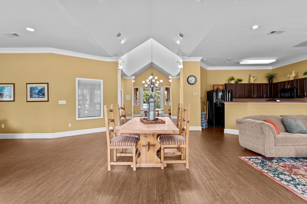 a dining room with a wooden table and chairs at Southgate Glen, Weatherford, TX