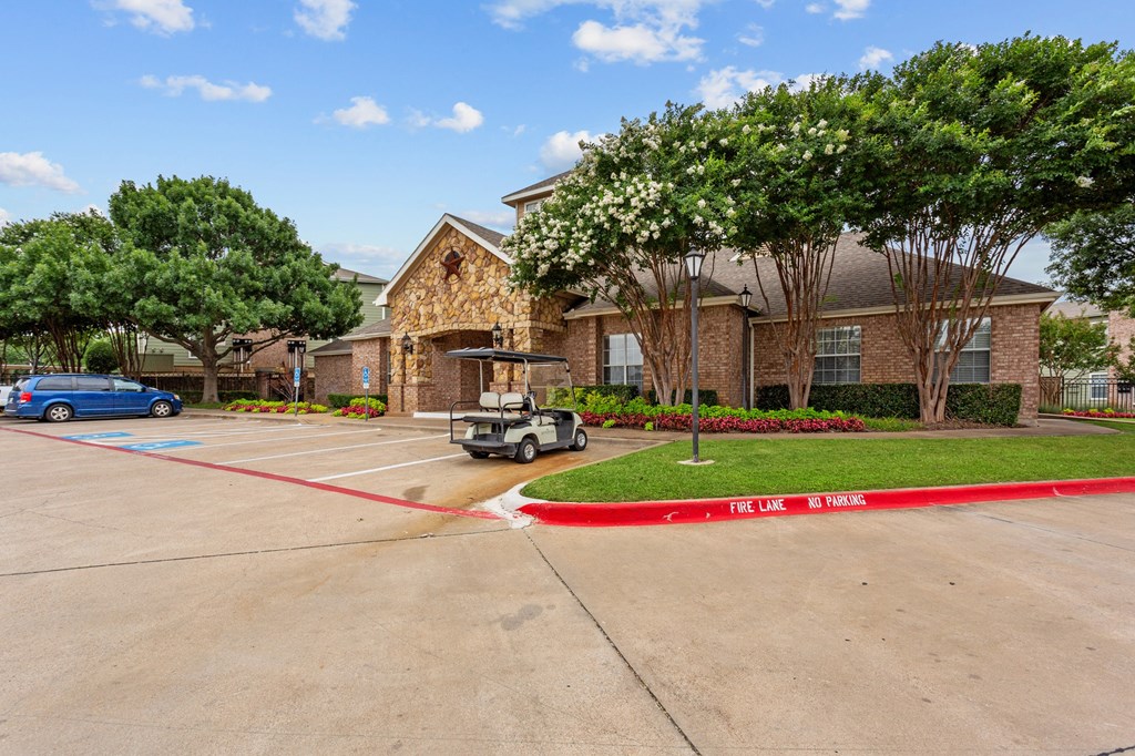 a home with a golf cart parked in front of a driveway at Southgate Glen, Texas