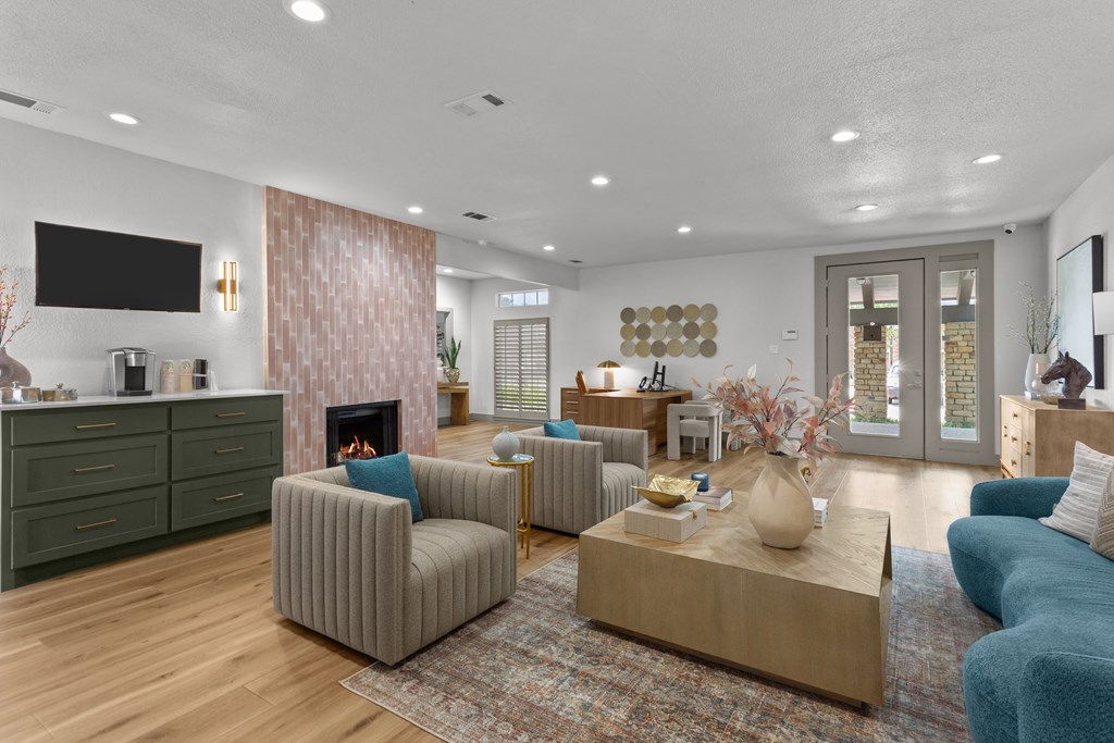 A living room with a fireplace and a television.