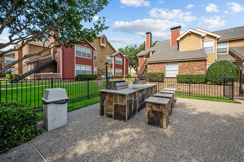 A sunny day at a residential area with houses and a park.