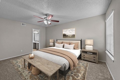 A bedroom with a bed, nightstand, and a ceiling fan.