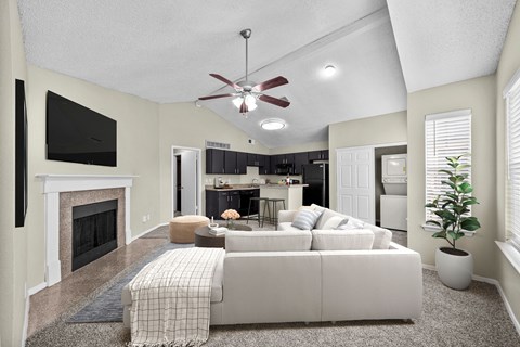 A living room with a fireplace and a couch.