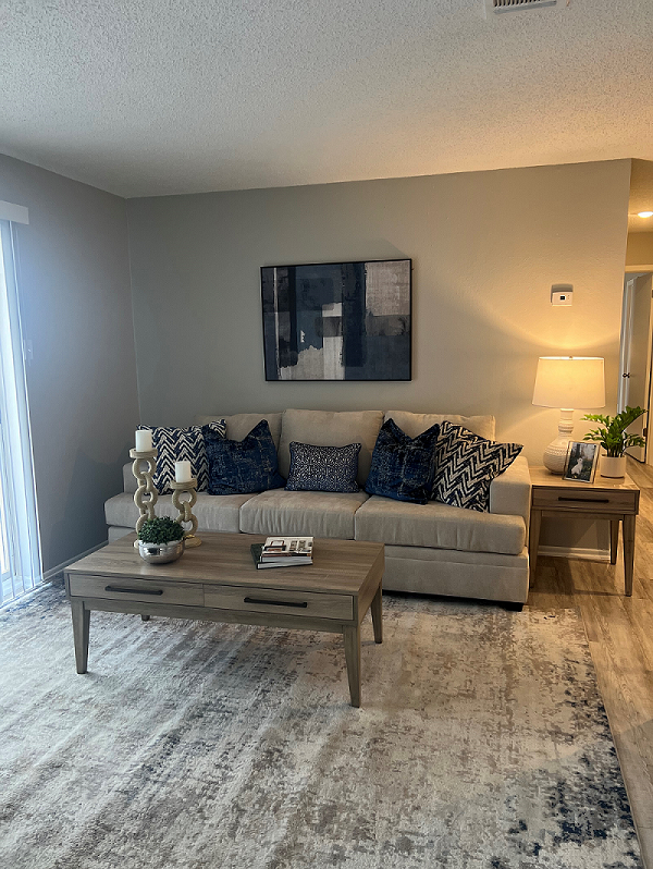 a living room with a couch and coffee table