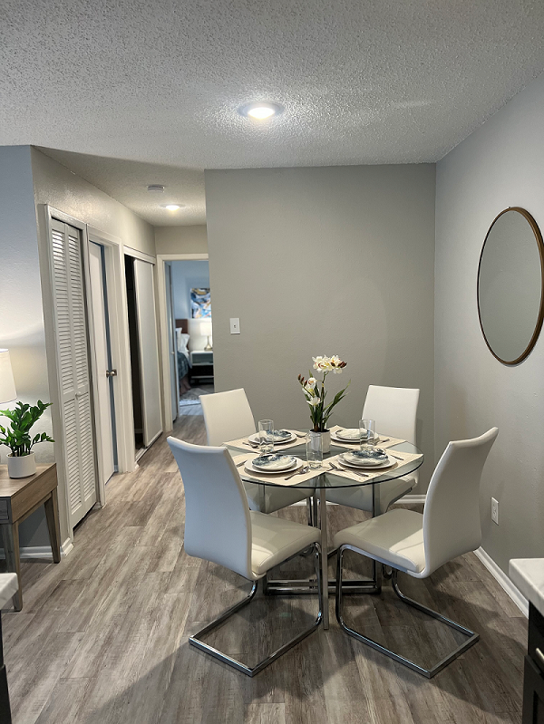 a dining room with a table and chairs