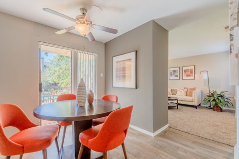 Dining area with living room view at Pinehurst Place Apartments, Mesquite, TX