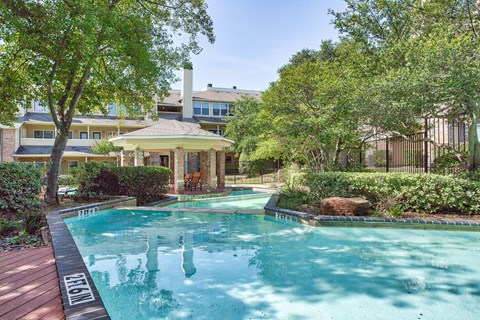 Resort style swimming pool with covered gazebo at Country Club Apartments, Texas