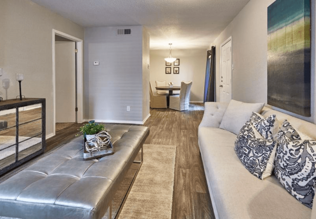 a living room with a couch and a table in the background