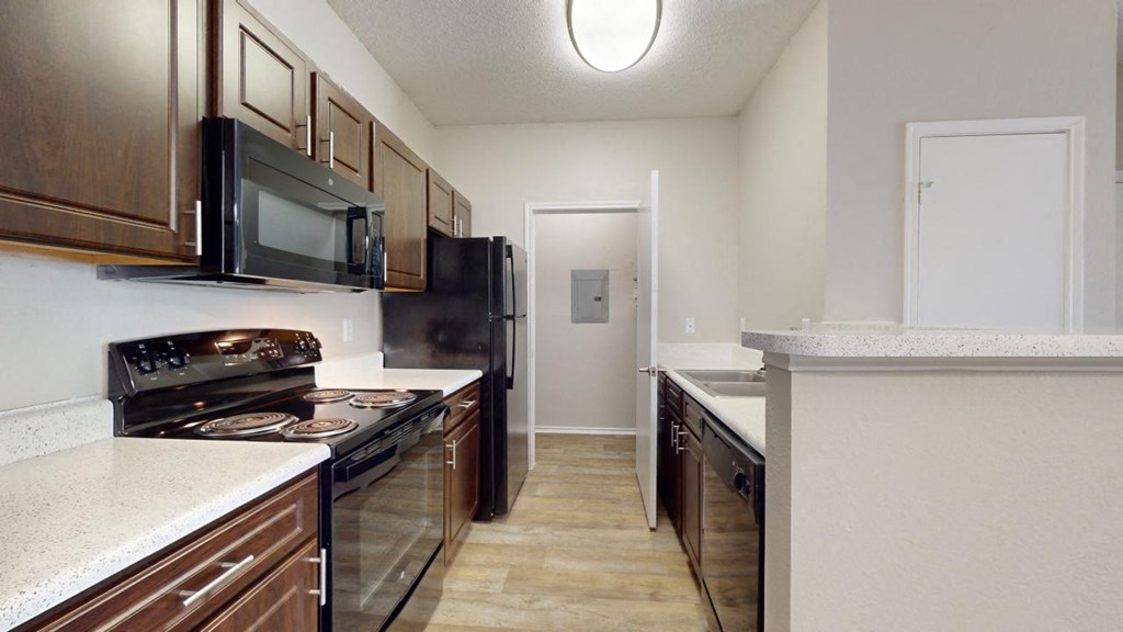 a kitchen with a stove and a microwave at Southgate Glen, Weatherford, TX, 76086