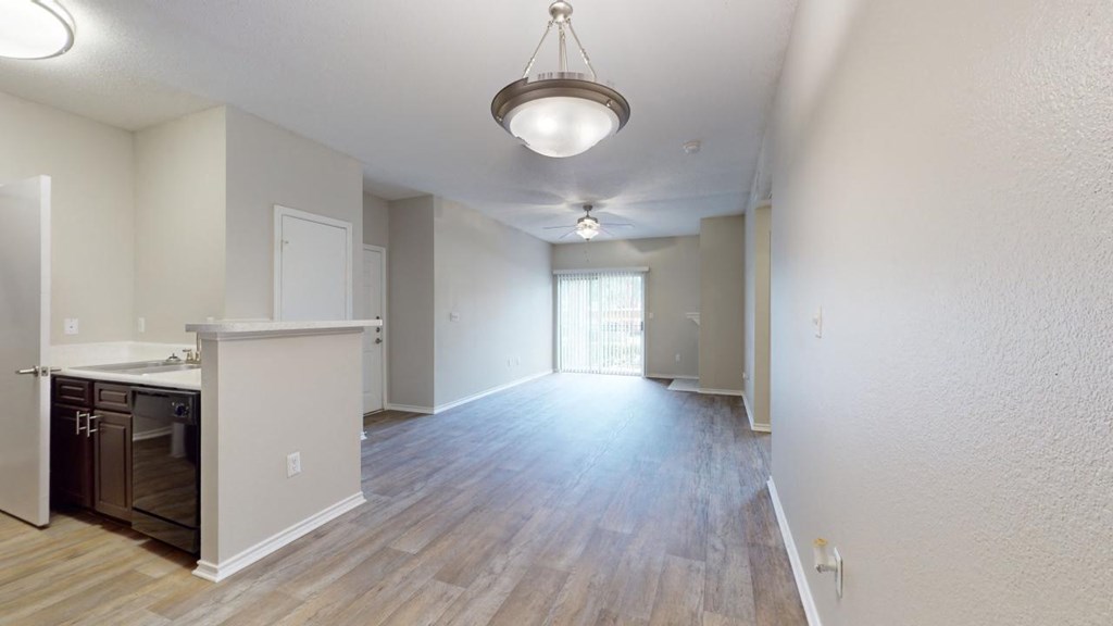 an empty room with rainbow colored lights on the floor at Southgate Glen, Texas