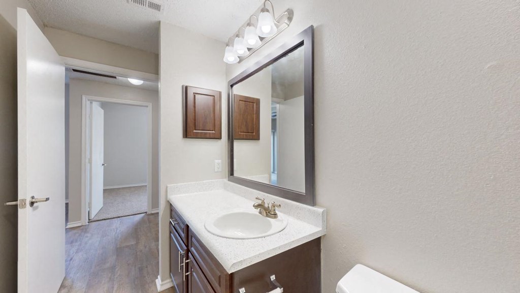 a bathroom with a sink and a mirror at Southgate Glen, Weatherford