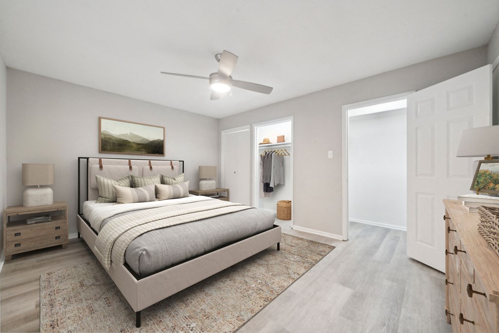 the master bedroom in a new apartment with a bed and closet