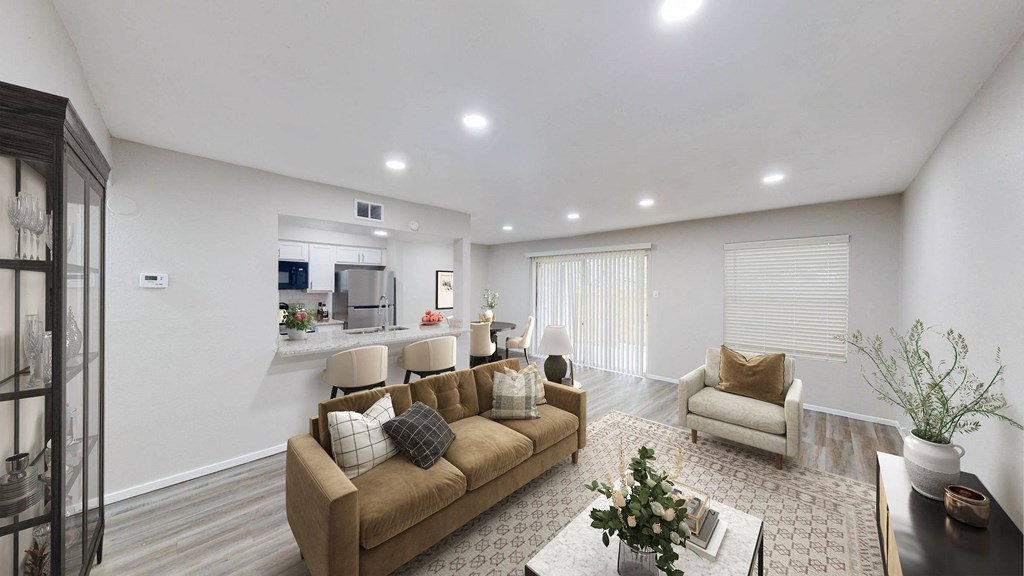a living room with couches and chairs at The Frederick, Texas