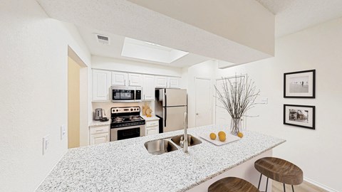 a kitchen with a counter top and a sink