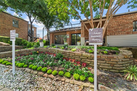 A garden with a sign that says "Future Resident Parking".