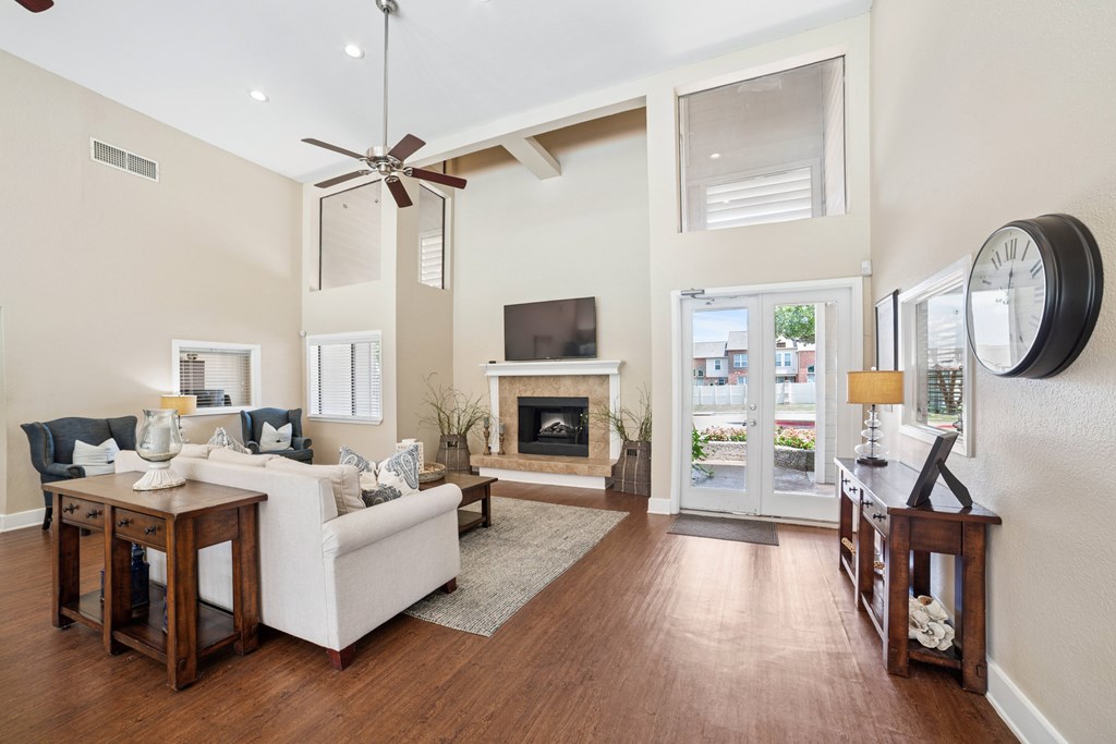 A living room with a fireplace and a television.