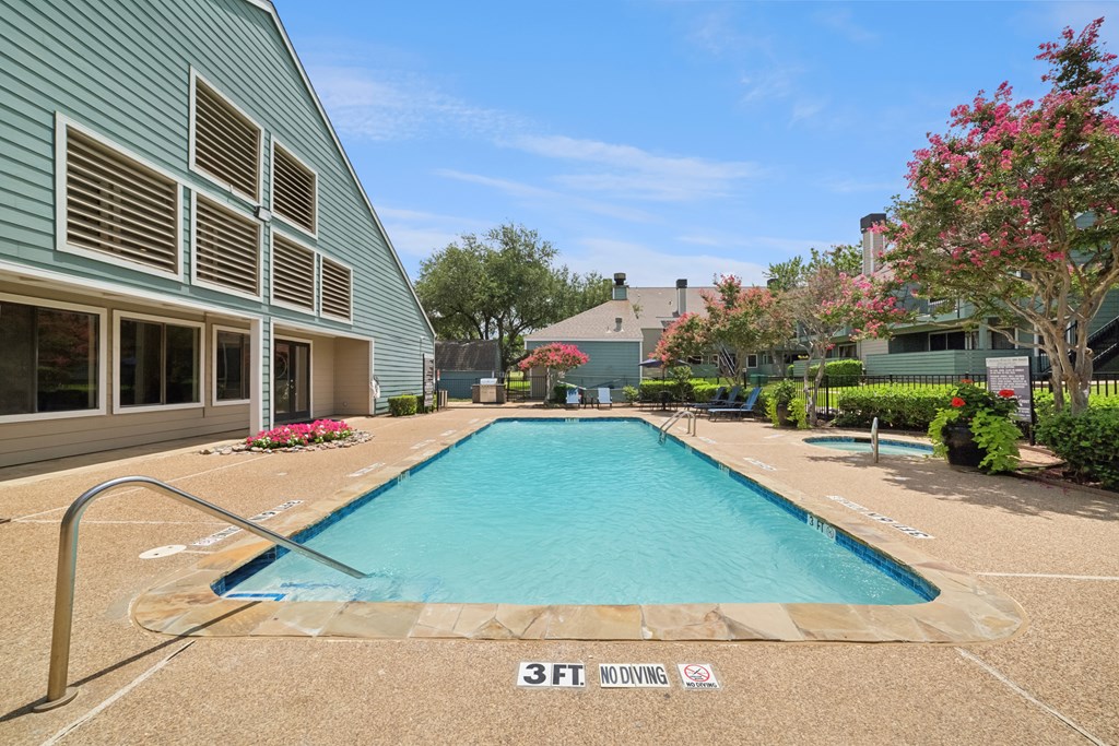 A pool with the text 3FT. NO DIVING on the ground.
