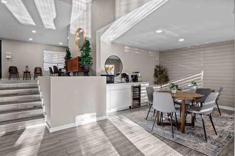 a kitchen and dining area with a table and chairs