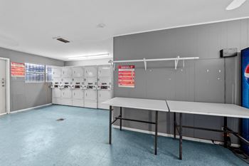 a locker room with lockers and a table at Sunset Heights, San Antonio, 78209